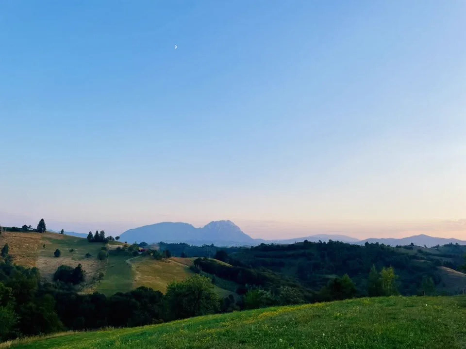 Mountain panorama at dusk with the moon