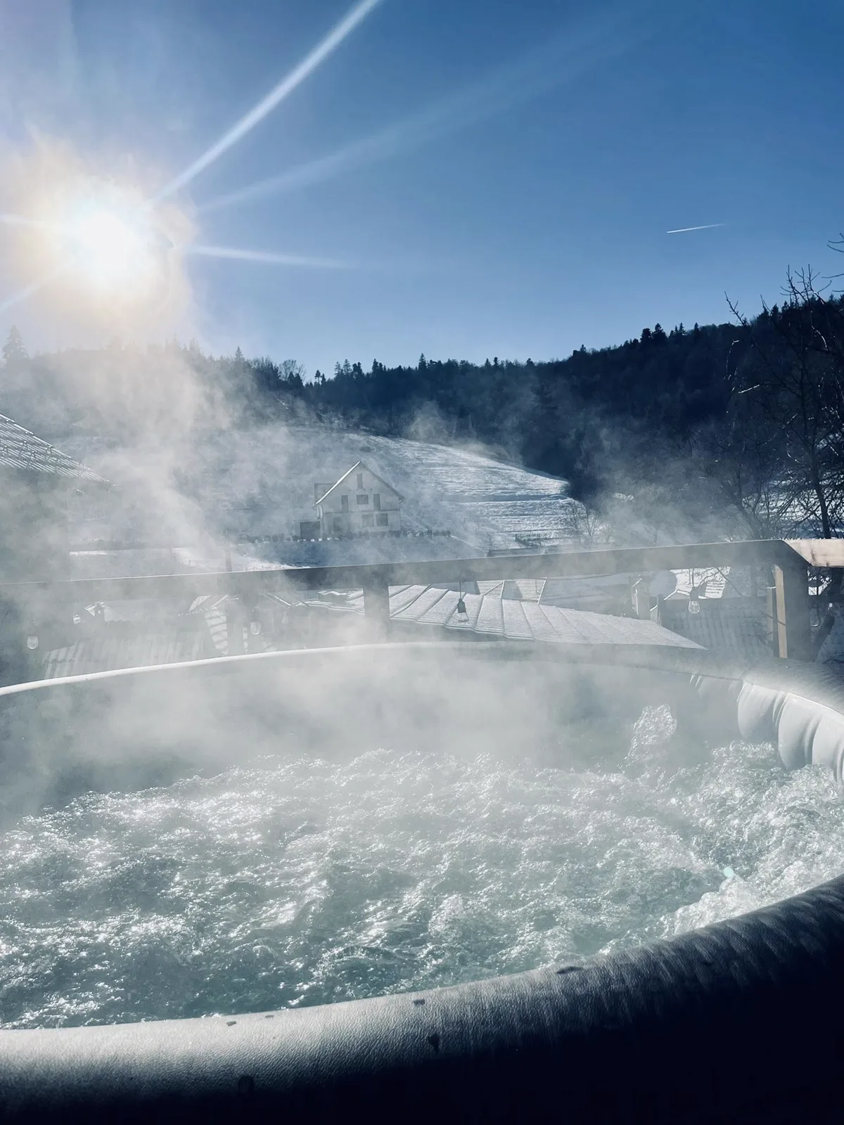 Hot tub steaming in the winter sunshine