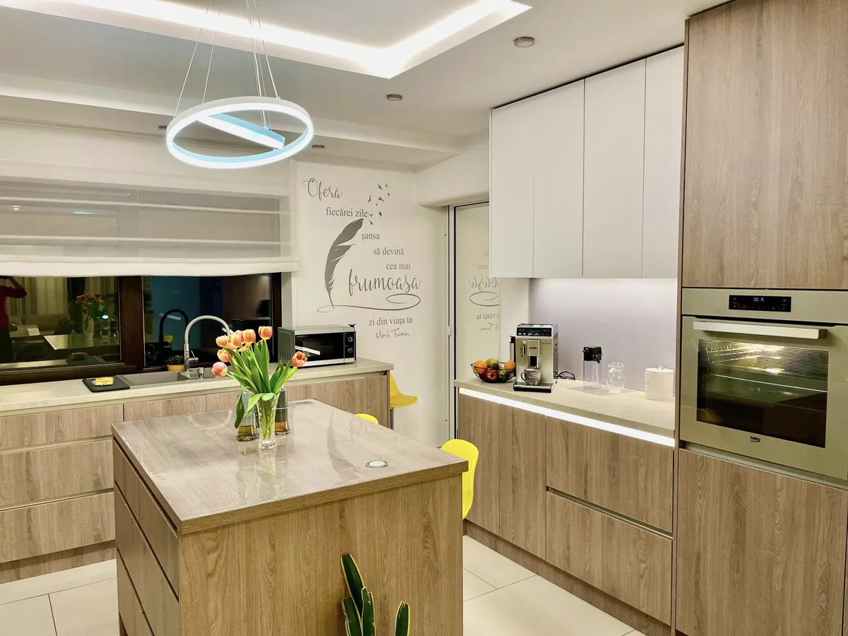 Kitchen with island, tulips and espresso machine