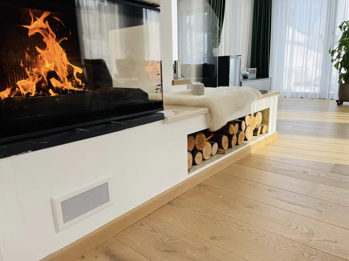 Fireplace with live flame and log pile