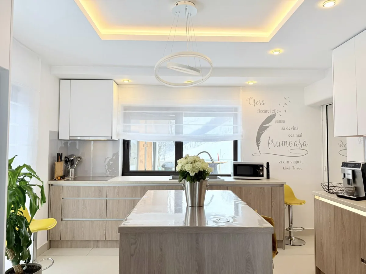 Modern kitchen with island and LED ceiling